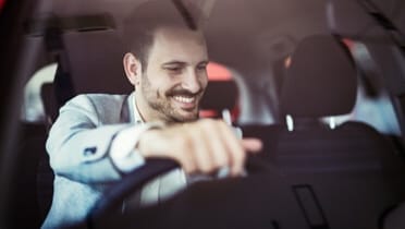 Corporate worker driving vehicle