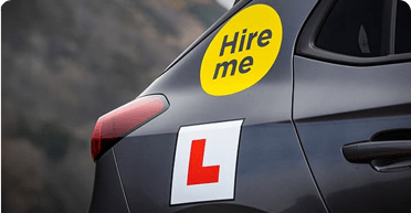 Hire me and L plate on car