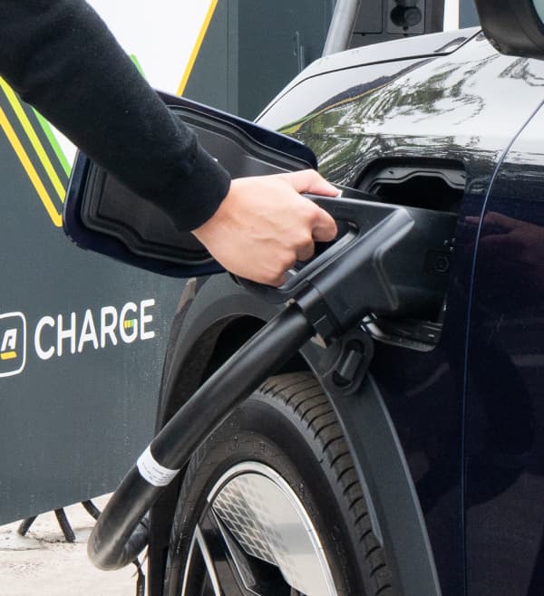 Arnold Clark Charge customer plugging charger into car