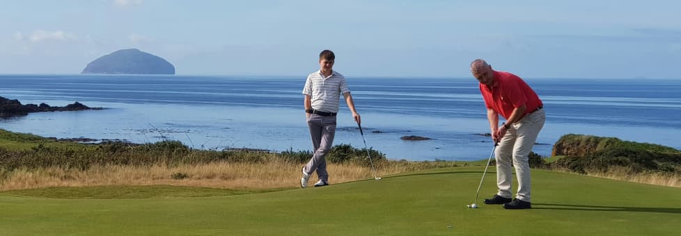 Two men playing golf